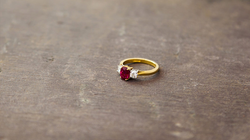 Ruby and gold ring on slate
